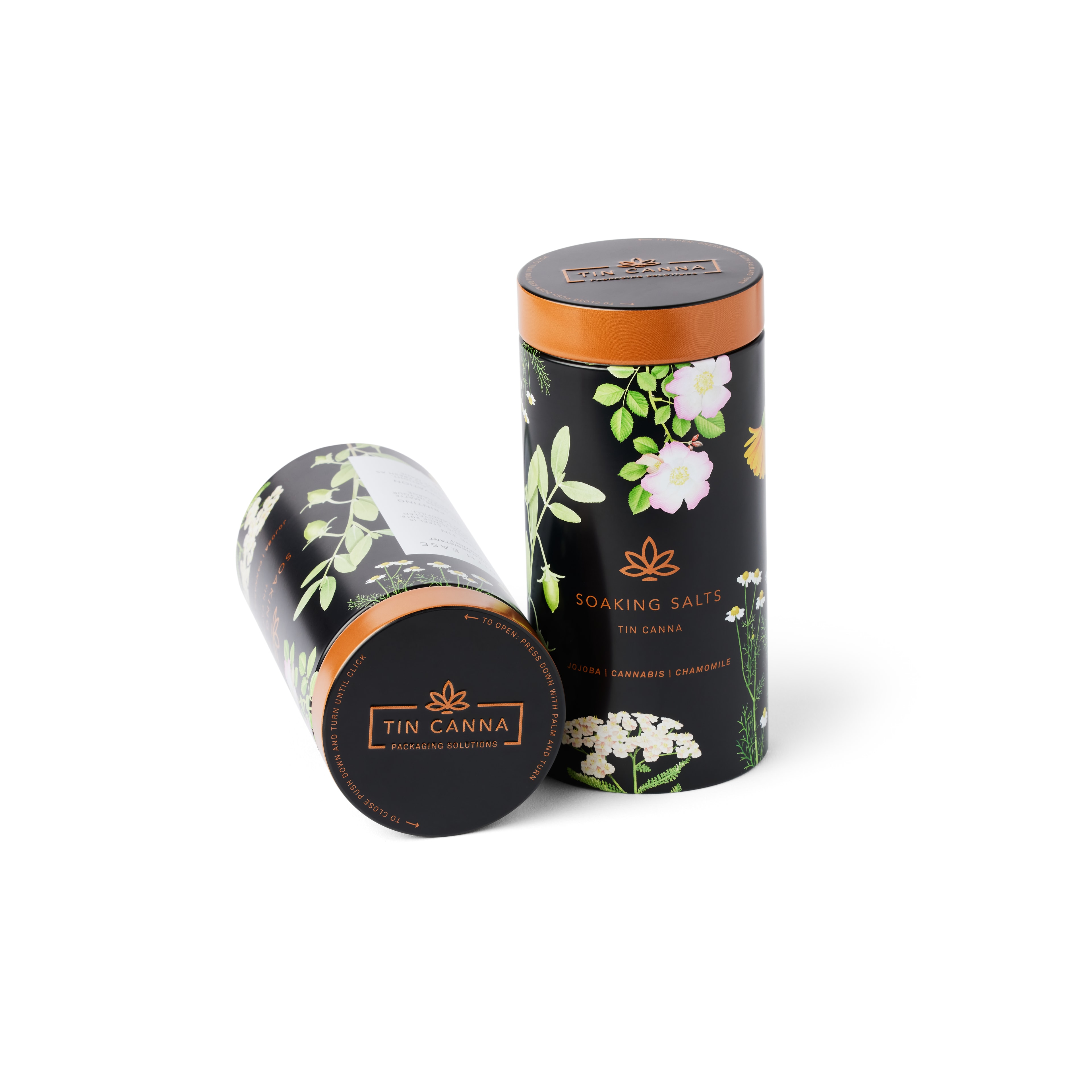 Tin Canna® Soaking Salts custom packaging — black floral cylindrical tins